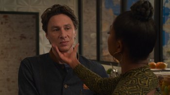 Movie still from “Cheaper by the Dozen” (2022), directed by Gail Lerner – A woman touching a man's face in front of a mirror; Close Up shot, Over the shoulder angle