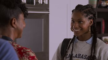 Movie still from “Cheaper by the Dozen” (2022), directed by Gail Lerner – Two young women are smiling for the camera; Close Up shot, Over the shoulder angle