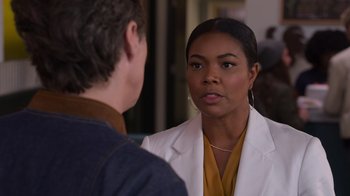 Movie still from “Cheaper by the Dozen” (2022), directed by Gail Lerner – A man and a woman talking to each other; Close Up shot, Over the shoulder angle