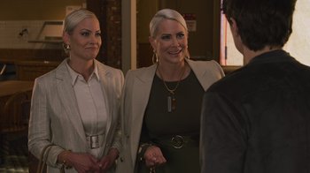 Movie still from “Cheaper by the Dozen” (2022), directed by Gail Lerner – A couple of women standing next to each other in a room; Close Up shot, Over the shoulder angle