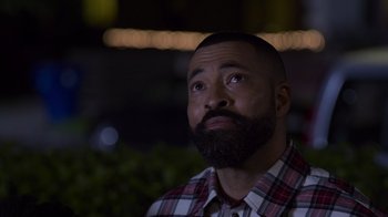 Movie still from “Cheaper by the Dozen” (2022), directed by Gail Lerner – A man with a goatee is looking upward; Close Up shot, Low angle