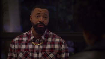 Movie still from “Cheaper by the Dozen” (2022), directed by Gail Lerner – A man with a beard wearing a plaid shirt; Close Up shot, Over the shoulder angle