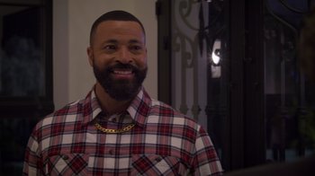 Movie still from “Cheaper by the Dozen” (2022), directed by Gail Lerner – A man with a beard wearing a red and white plaid shirt; Close Up shot, Over the shoulder angle
