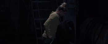 Movie still from “Chemical Hearts” (2020), directed by Richard Tanne – A woman in a yellow shirt is standing on some stairs; Medium shot, High angle