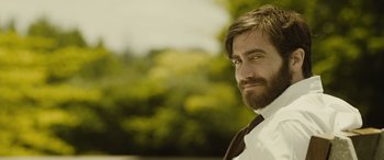 Movie still from “Enemy” (2013), directed by Denis Villeneuve – A person with a beard; Close Up shot, Over the shoulder angle