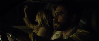 Movie still from “Enemy” (2013), directed by Denis Villeneuve – A man and a woman sitting in a car at night; Close Up shot, Over the shoulder angle