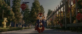 Movie still from “Chip 'n Dale: Rescue Rangers” (2022), directed by Akiva Schaffer – A cartoon character dressed in a suit and tie standing on the sidewalk; Wide shot, High angle