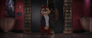 Movie still from “Chip 'n Dale: Rescue Rangers” (2022), directed by Akiva Schaffer – A cartoon character is standing in front of a door; Wide shot, Over the shoulder angle