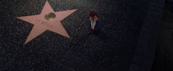 Movie still from “Chip 'n Dale: Rescue Rangers” (2022), directed by Akiva Schaffer – A cartoon character is standing on the walk of fame; Wide shot, Overhead angle