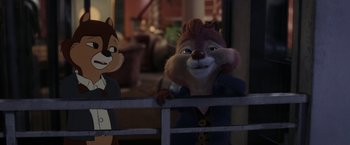 Movie still from “Chip 'n Dale: Rescue Rangers” (2022), directed by Akiva Schaffer – A squirrel is standing next to an animated character; Medium shot, Over the shoulder angle