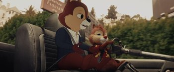 Movie still from “Chip 'n Dale: Rescue Rangers” (2022), directed by Akiva Schaffer – A couple of cartoon characters sitting next to each other on a motorcycle; Medium shot, High angle