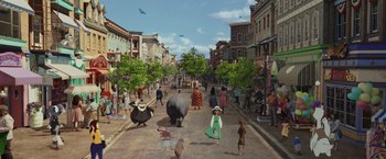 Movie still from “Chip 'n Dale: Rescue Rangers” (2022), directed by Akiva Schaffer – An artist's rendering of people walking down a street; Wide shot, High angle