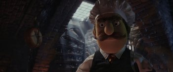 Movie still from “Chip 'n Dale: Rescue Rangers” (2022), directed by Akiva Schaffer – The head of a man with a mustache wearing a hat; Close Up shot, Low angle