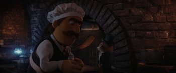 Movie still from “Chip 'n Dale: Rescue Rangers” (2022), directed by Akiva Schaffer – A man in a chef's outfit and a mouse in a suit; Medium shot, Over the shoulder angle