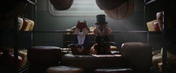 Movie still from “Chip 'n Dale: Rescue Rangers” (2022), directed by Akiva Schaffer – A couple of stuffed animals sitting next to each other; Wide shot, Low angle