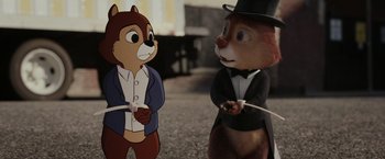Movie still from “Chip 'n Dale: Rescue Rangers” (2022), directed by Akiva Schaffer – A couple of cartoon characters that are standing up together; Close Up shot, Over the shoulder angle