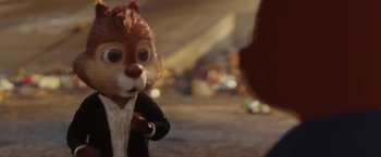 Movie still from “Chip 'n Dale: Rescue Rangers” (2022), directed by Akiva Schaffer – A stuffed squirrel wearing a suit and tie; Close Up shot, Over the shoulder angle
