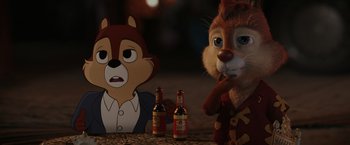 Movie still from “Chip 'n Dale: Rescue Rangers” (2022), directed by Akiva Schaffer – A couple of stuffed animals sitting on top of a table; Close Up shot, Over the shoulder angle