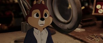 Movie still from “Chip 'n Dale: Rescue Rangers” (2022), directed by Akiva Schaffer – A cartoon of a man wearing a suit and tie; Close Up shot, Over the shoulder angle