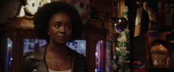 Movie still from “Chip 'n Dale: Rescue Rangers” (2022), directed by Akiva Schaffer – A woman standing in front of a mirror in a room; Close Up shot, Over the shoulder angle