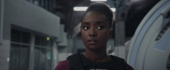 Movie still from “Chip 'n Dale: Rescue Rangers” (2022), directed by Akiva Schaffer – A person wearing a black shirt; Close Up shot, Over the shoulder angle