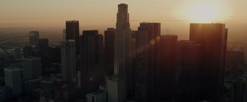 Movie still from “Chip 'n Dale: Rescue Rangers” (2022), directed by Akiva Schaffer – The sun is setting over a large city; Extreme Wide shot, High angle