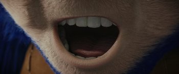 Movie still from “Chip 'n Dale: Rescue Rangers” (2022), directed by Akiva Schaffer – View of a man's mouth and teeth; Extreme Close Up shot, Overhead angle