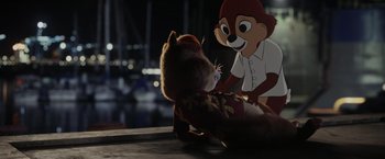 Movie still from “Chip 'n Dale: Rescue Rangers” (2022), directed by Akiva Schaffer – A stuffed animal and a stuffed animal on a table; Medium shot, High angle