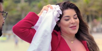 Movie still from “Christmas Full of Grace” (2022), directed by Pedro Antônio Paes – A woman is holding a white cloth over her face; Close Up shot, High angle