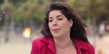 Movie still from “Christmas Full of Grace” (2022), directed by Pedro Antônio Paes – A person wearing a pink jacket; Close Up shot, Low angle