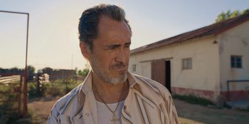 Movie still from “Chupa” (2023), directed by Jonás Cuarón – A person wearing a jacket; Close Up shot, Over the shoulder angle