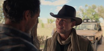 Movie still from “Chupa” (2023), directed by Jonás Cuarón – A man wearing a cowboy hat talking to another man; Close Up shot, Over the shoulder angle