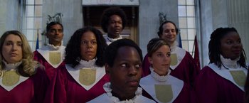 Movie still from “Cinderella” (2021), directed by Kay Cannon – A group of men and women standing next to each other; Medium shot, Low angle