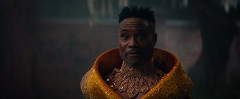 Movie still from “Cinderella” (2021), directed by Kay Cannon – A person wearing a costume; Close Up shot, Over the shoulder angle