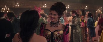 Movie still from “Cinderella” (2021), directed by Kay Cannon – A woman in a fancy dress talking to a friend; Close Up shot, Over the shoulder angle
