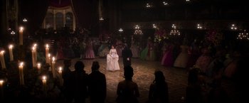 Movie still from “Cinderella” (2021), directed by Kay Cannon – A group of people dressed up in fancy gowns; Extreme Wide shot, High angle
