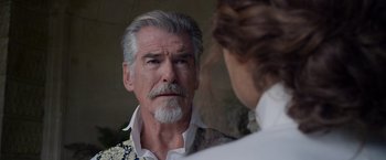 Movie still from “Cinderella” (2021), directed by Kay Cannon – A man looking at himself in the mirror; Close Up shot, Over the shoulder angle