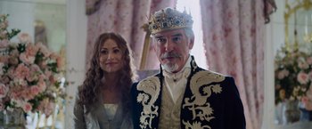 Movie still from “Cinderella” (2021), directed by Kay Cannon – A man and a woman dressed in medieval garb; Close Up shot, Low angle