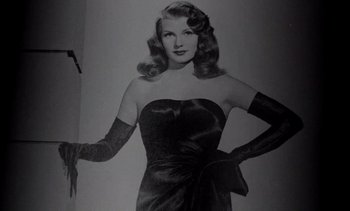 Movie still from “Cinema Paradiso” (1988), directed by Giuseppe Tornatore – A black and white photo of a woman in a dress; Medium shot, Low angle