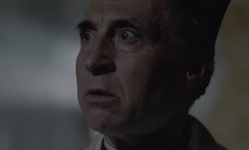 Movie still from “Cinema Paradiso” (1988), directed by Giuseppe Tornatore – An older man looking up into the air; Close Up shot, Low angle