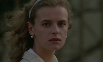 Movie still from “Cinema Paradiso” (1988), directed by Giuseppe Tornatore – A person wearing a white shirt; Close Up shot, Low angle