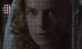 Movie still from “Cinema Paradiso” (1988), directed by Giuseppe Tornatore – A woman's face in the dark; Extreme Close Up shot, Overhead angle