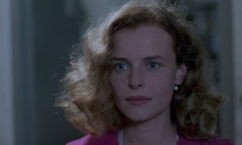 Movie still from “Cinema Paradiso” (1988), directed by Giuseppe Tornatore – A person wearing a pink shirt; Close Up shot, Over the shoulder angle