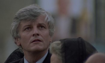 Movie still from “Cinema Paradiso” (1988), directed by Giuseppe Tornatore – A person wearing a suit and tie; Close Up shot, Low angle