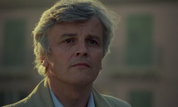 Movie still from “Cinema Paradiso” (1988), directed by Giuseppe Tornatore – A person wearing a jacket; Close Up shot, Low angle