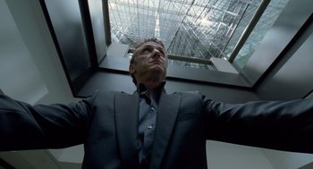 Movie still from “The Tree of Life” (2011), directed by Terrence Malick – A man in a suit and tie looking up at the sky; Medium shot, Low angle
