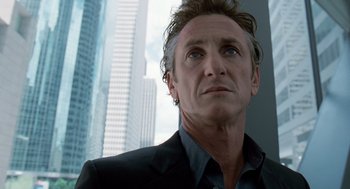 Movie still from “The Tree of Life” (2011), directed by Terrence Malick – A person wearing a suit and looking up; Close Up shot, Low angle