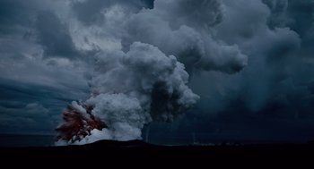 Movie still from “The Tree of Life” (2011), directed by Terrence Malick – A cloud of smoke billows out of the ground; Extreme Wide shot, High angle