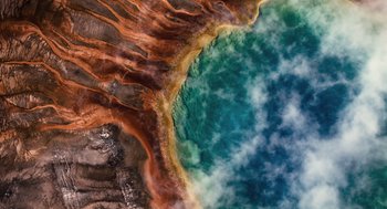 Movie still from “The Tree of Life” (2011), directed by Terrence Malick – An aerial view of a body of water; Extreme Wide shot, Overhead angle