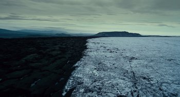 Movie still from “The Tree of Life” (2011), directed by Terrence Malick – A view of a frozen lake from a distance; Extreme Wide shot, High angle